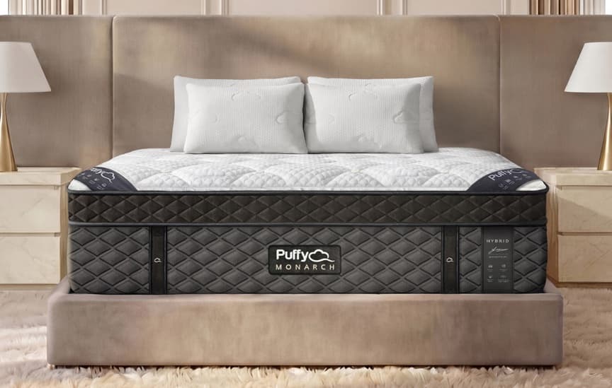 Puffy Monarch Hybrid mattress on a low platform bed