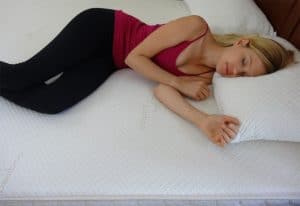 a sleeping woman suffering from a bad back