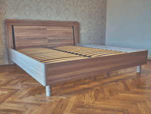 A wooden foundation in a room with cold hard floor