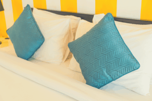 4 memory foam pillows in a large-sized bed