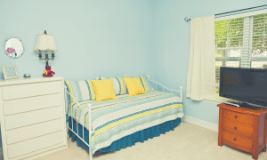 daybed with 2 pillows located in a bedroom
