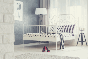metallic platform bed in a bedroom