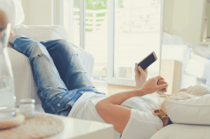 woman lying in bed with an elevated leg