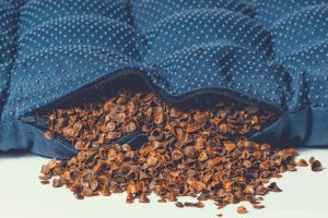 blue colored pillow filled with organic buckwheat hulls