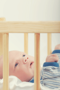 baby lying in his crib