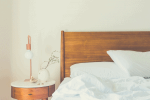 bedroom with white bed sheets
